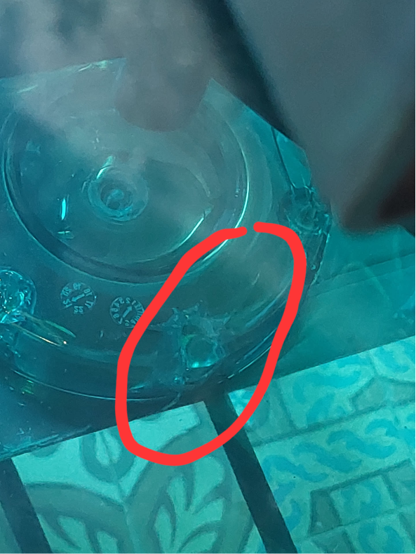 Image from the top of the tank, looking at the crack. There's a red circle around the one that was visibel in the previous picture. There's also multiple other cracks visible!